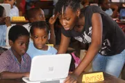 Sao Tome &amp;amp; Principe youth helping children learn in classroom