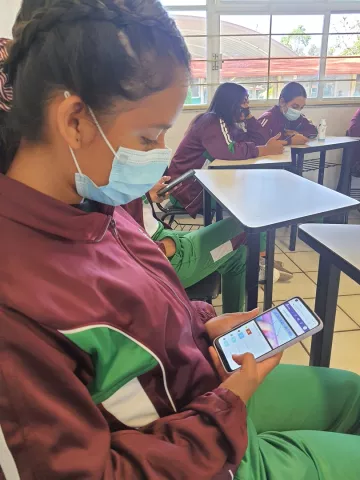 girl using learning passport on mobile device